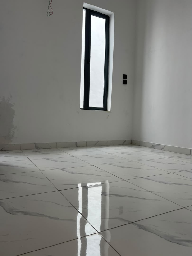 Open plan living and dining space with feature lighting